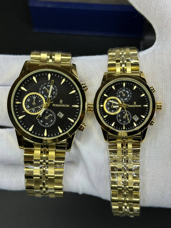 ساعت طرح کرنو ست مردانه و زنانه رومانسون طلایی صفحه مشکی